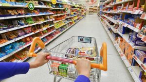 © Shutterstock Shopping cart in supermarket aisle