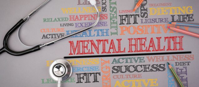 Mental Health. Colored pencils and a stetoscope on the table